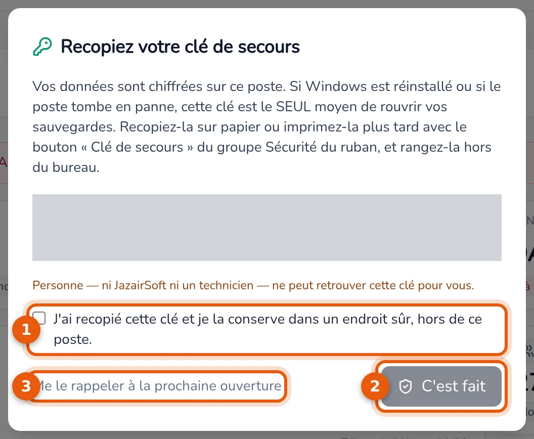 Fenêtre Recopiez votre clé de secours : case d'engagement, bouton C'est fait et lien de rappel numérotés de 1 à 3, la clé masquée